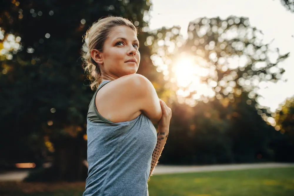 woman stretching before exercising
